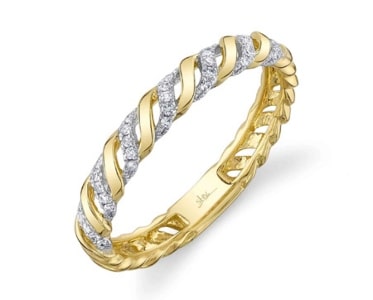 a yellow gold diamond wedding band with a twist design from Shy Creation.