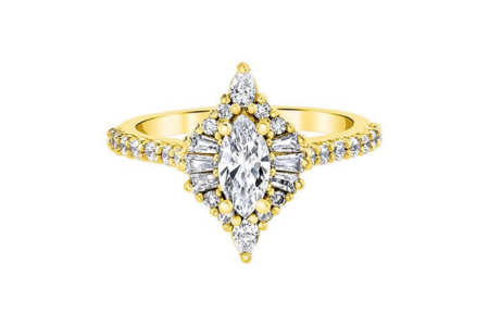 An elegant Love Story engagement ring with a marquise center stone, available at Albert’s Diamond Jewelers.