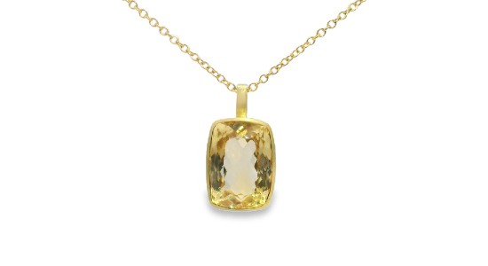 a yellow gold pendant necklace with a large yellow citrine