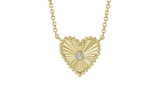 a yellow gold heart shaped pendant necklace with a round cut diamond at the center