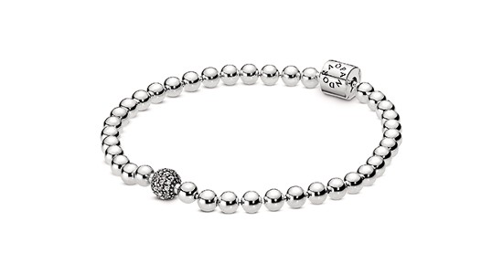 Silver beaded bracelet from Pandora with a larger, detailed bead at the center
