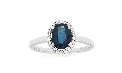 White gold and sapphire fashion ring with a diamond halo setting