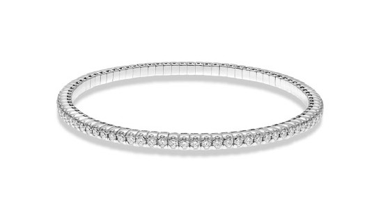 Close up image of a silver stretch bangle with diamonds inlaid all the way around it