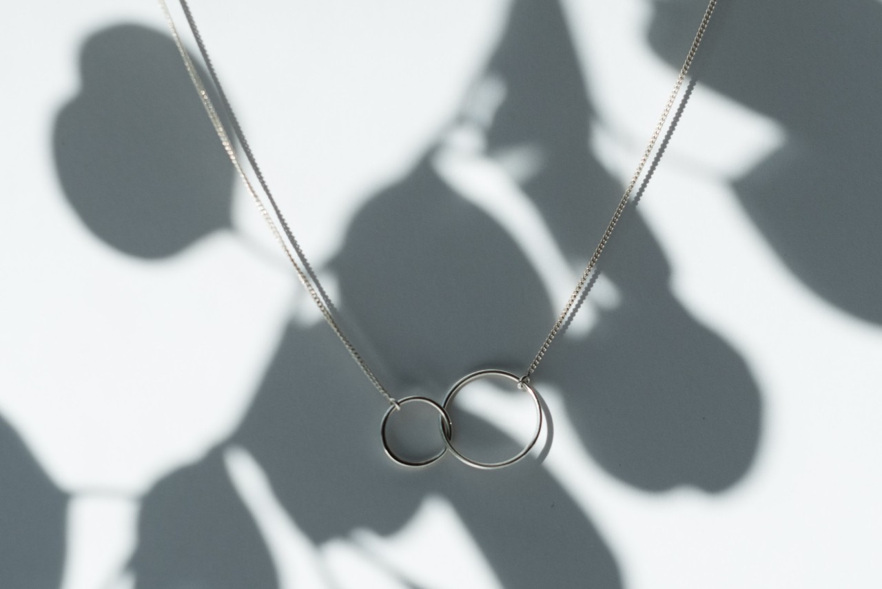Sterling silver necklace with interweaving rings.